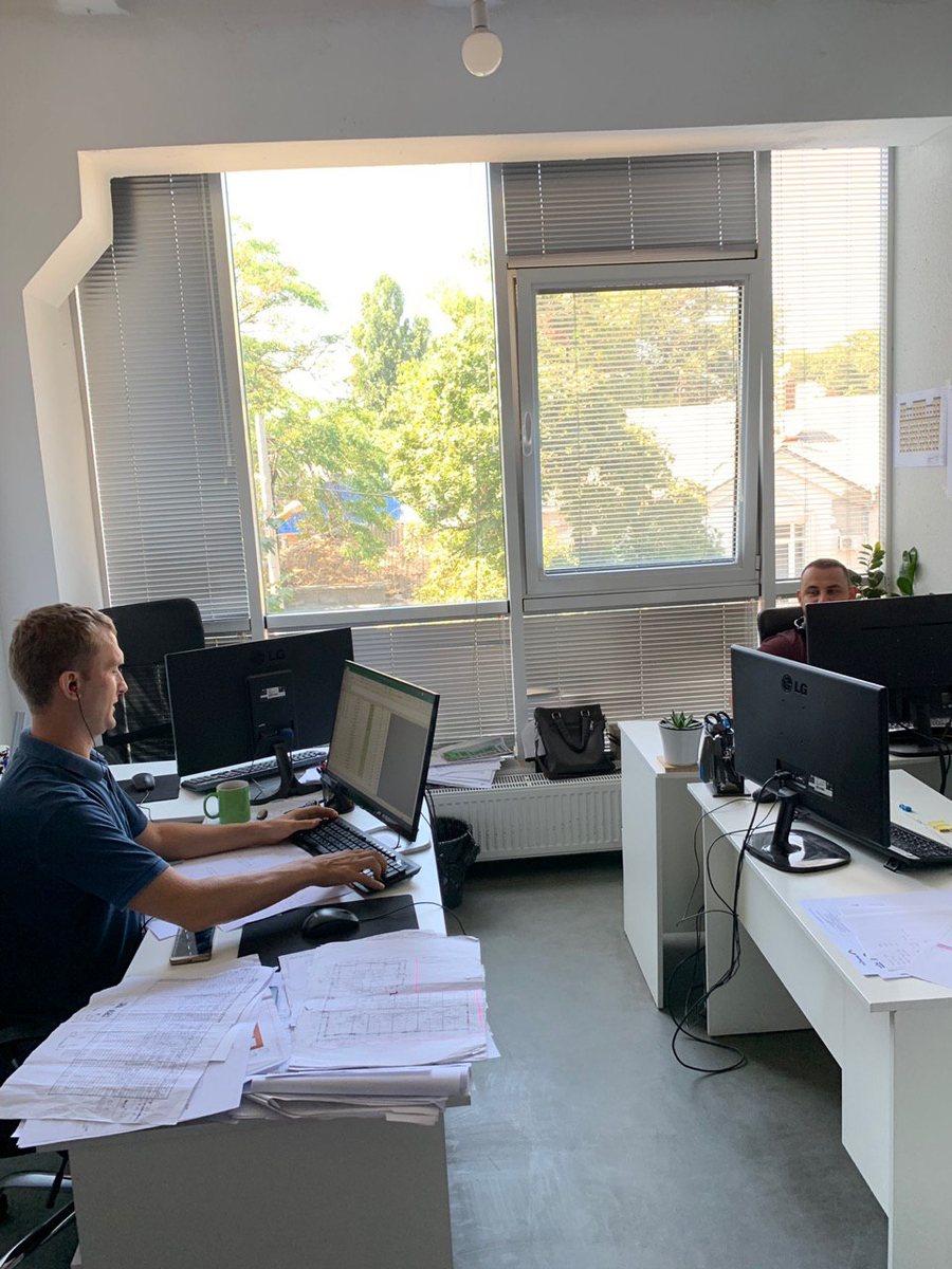 Tech Façade engineers at their desks in the office, 2019